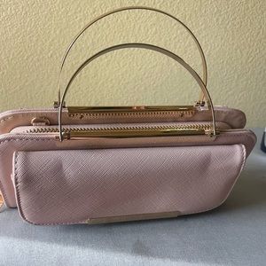 Clutch purse with gold tone handle